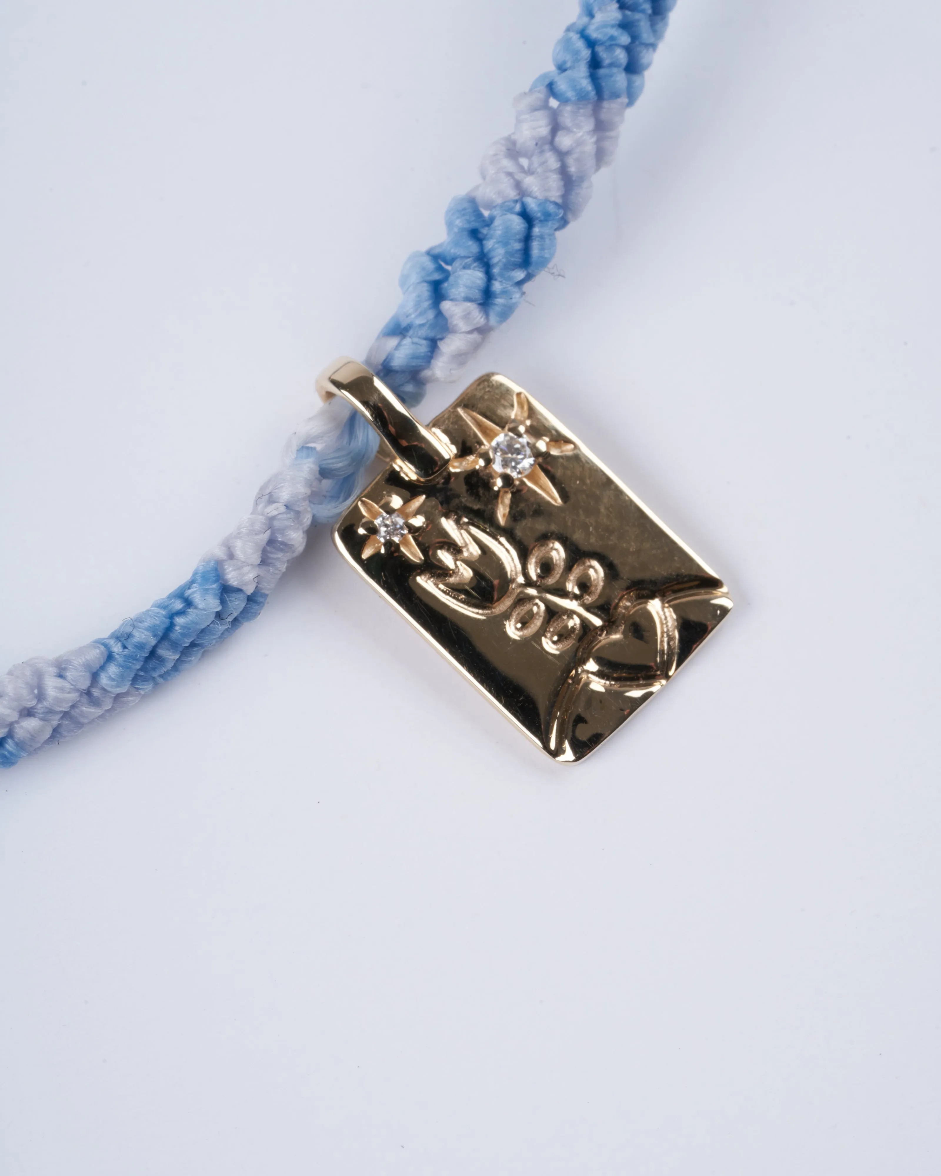 adjustable macrame bracelet with flower tag - gold