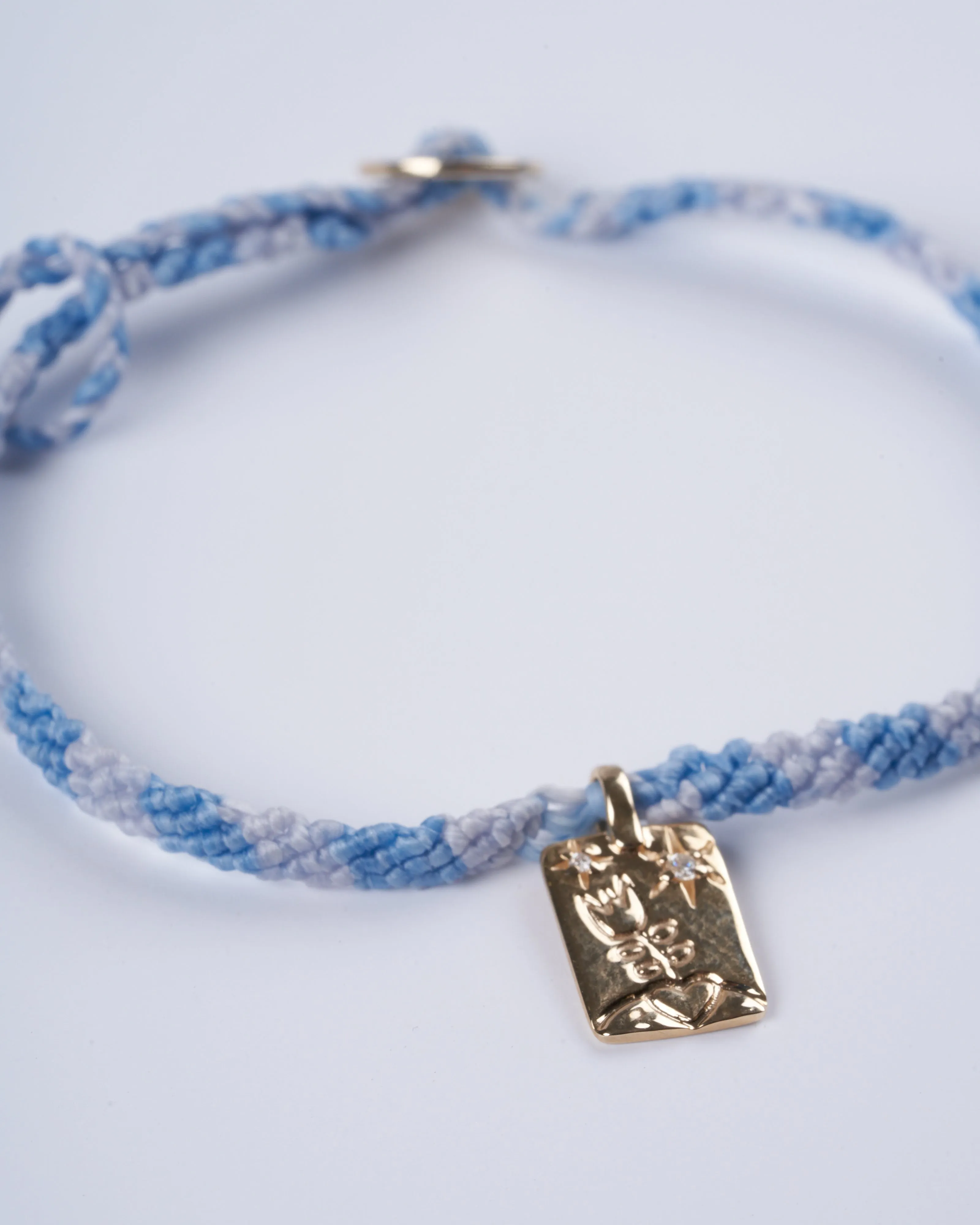 adjustable macrame bracelet with flower tag - gold